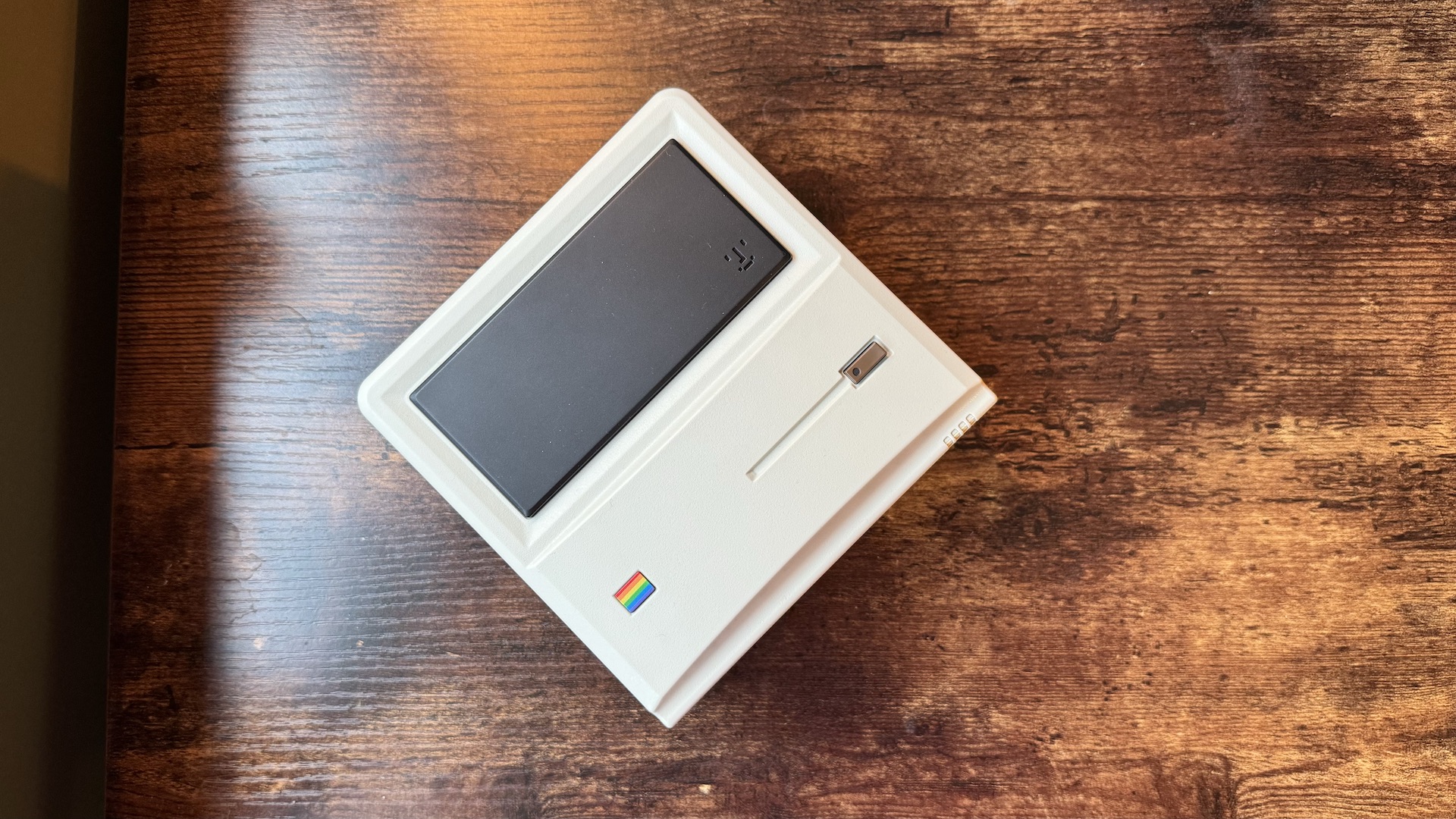 AyaNeo Retro Mini PC AM01 on a wooden home office desk