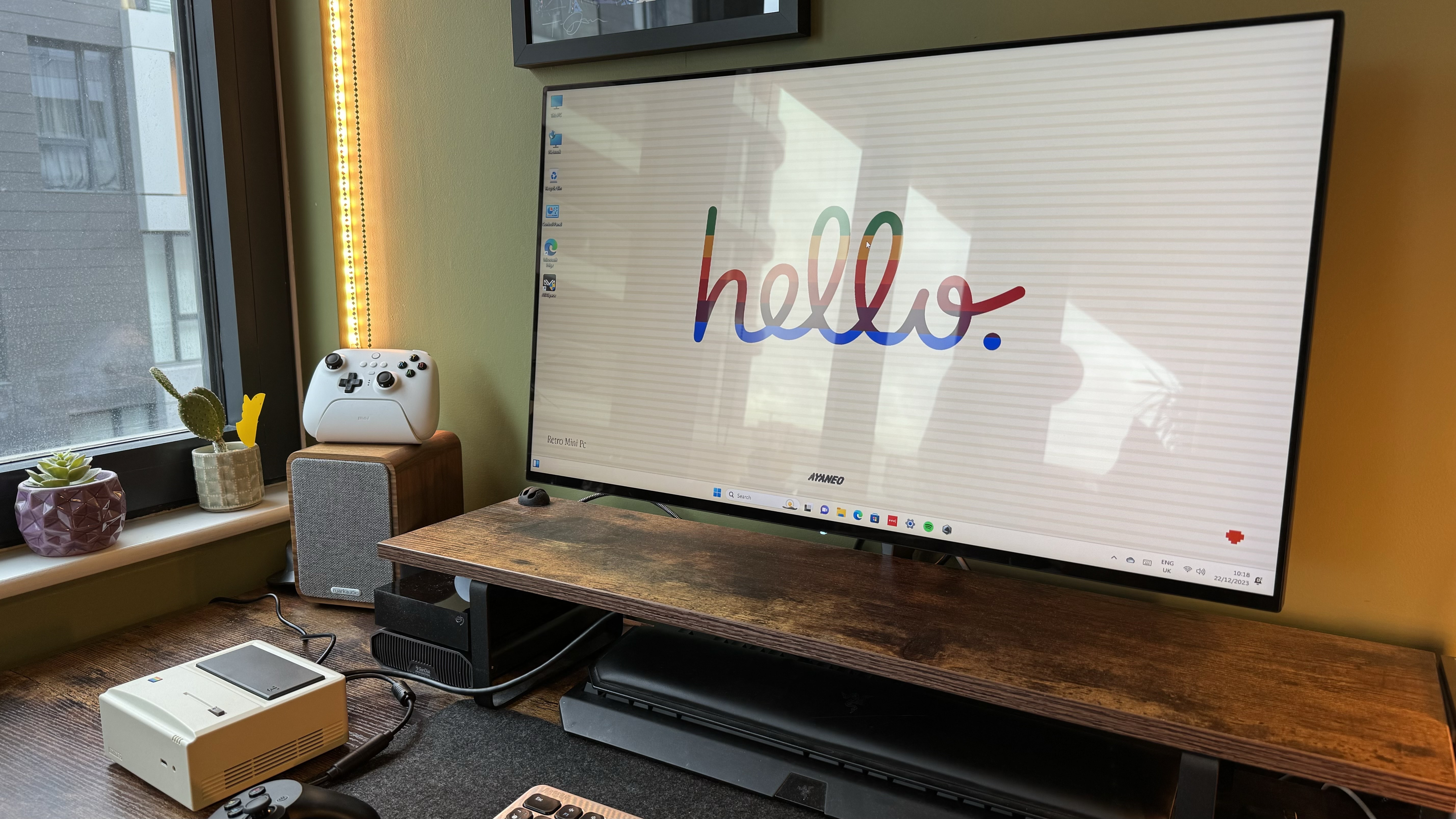 AyaNeo Retro Mini PC AM01 on a wooden home office desk